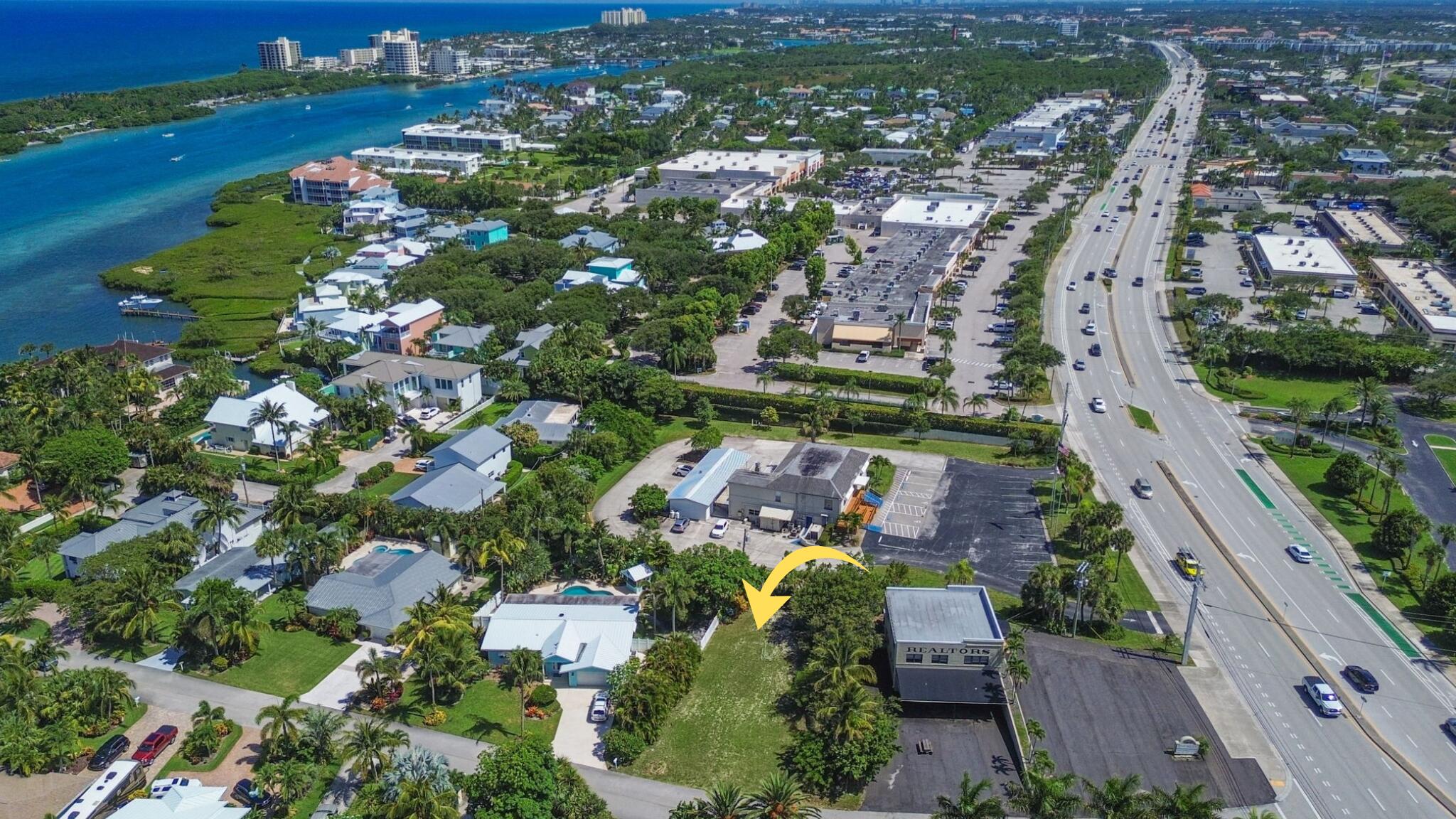 3442 Harbor Road South Jupiter, FL 33469 - Photo 6 of 8 an aerial view of residential houses with outdoor space