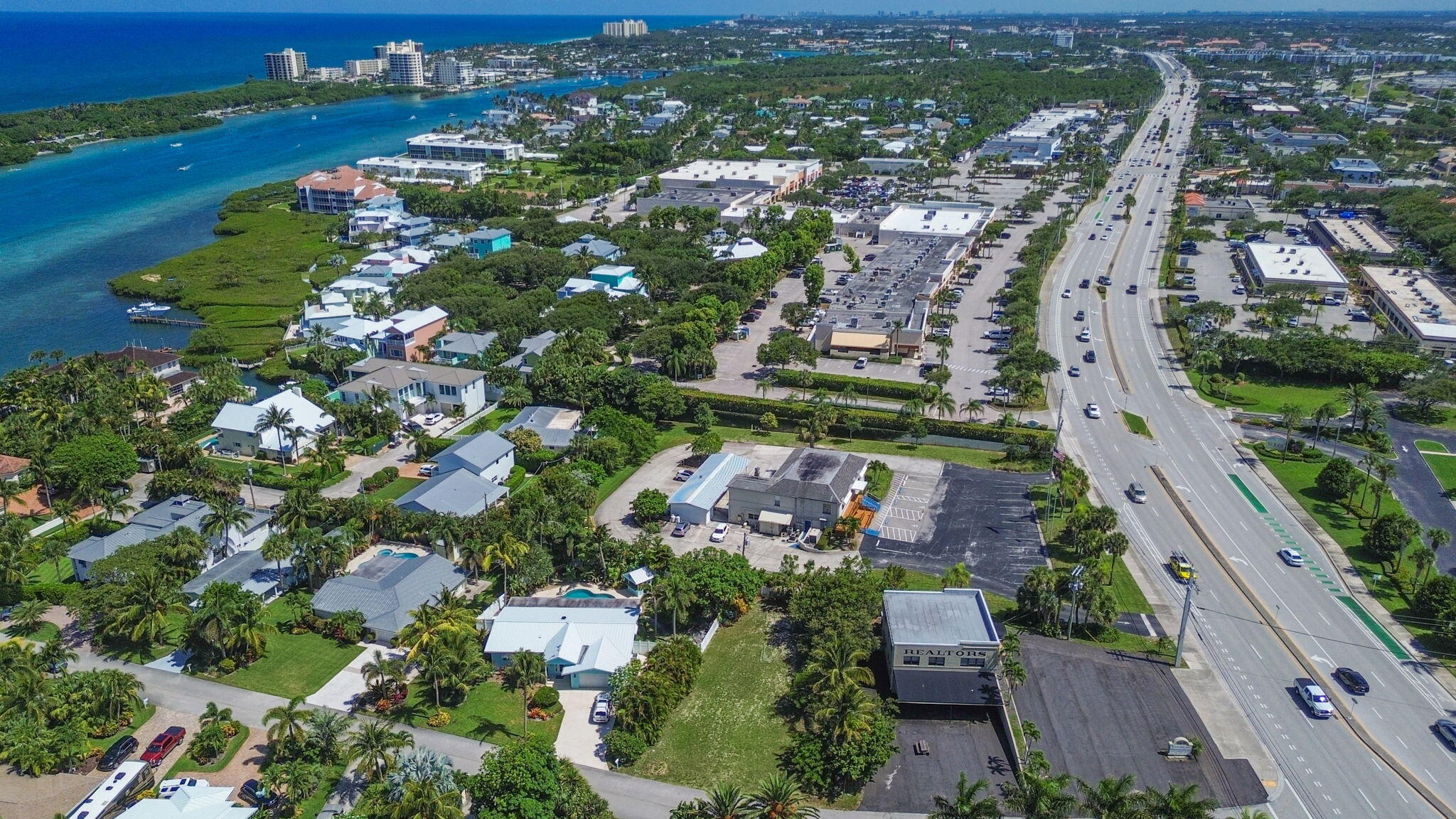 3442 Harbor Road South Jupiter, FL 33469 - Photo 7 of 8 an aerial view of residential houses with outdoor space