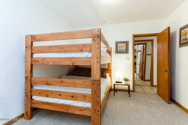 a backyard of a house with lots of green space and plants