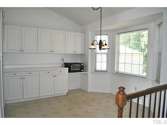103 Rope Swing Circle Benson, NC 27504 - Photo 13 of 23 Spacious dining area with additional cabinets and counter space and sunny bay window.