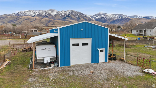 1009 High Creek Road Cove, UT 84320 - Photo 10 of 79 Garage featuring a mountain view and a detached garage