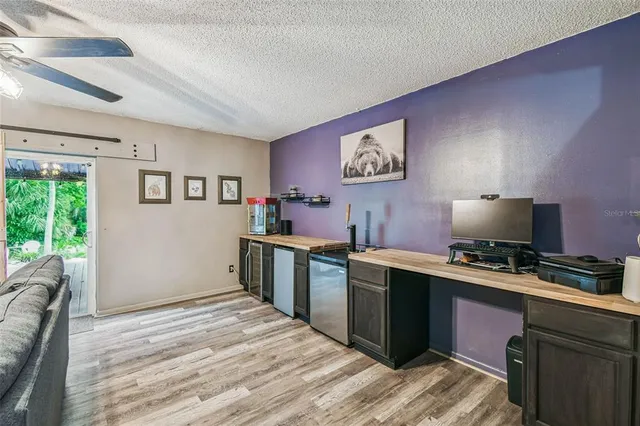 a spacious bedroom with a bed and a window