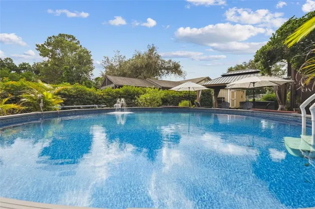 a view of a backyard with sitting area