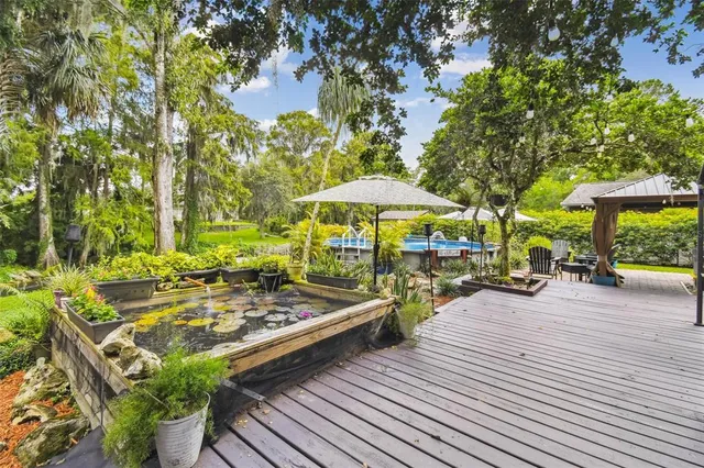 a view of a house with a yard porch and sitting area