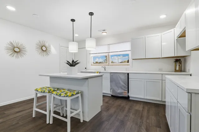 a kitchen with a table and chairs in it