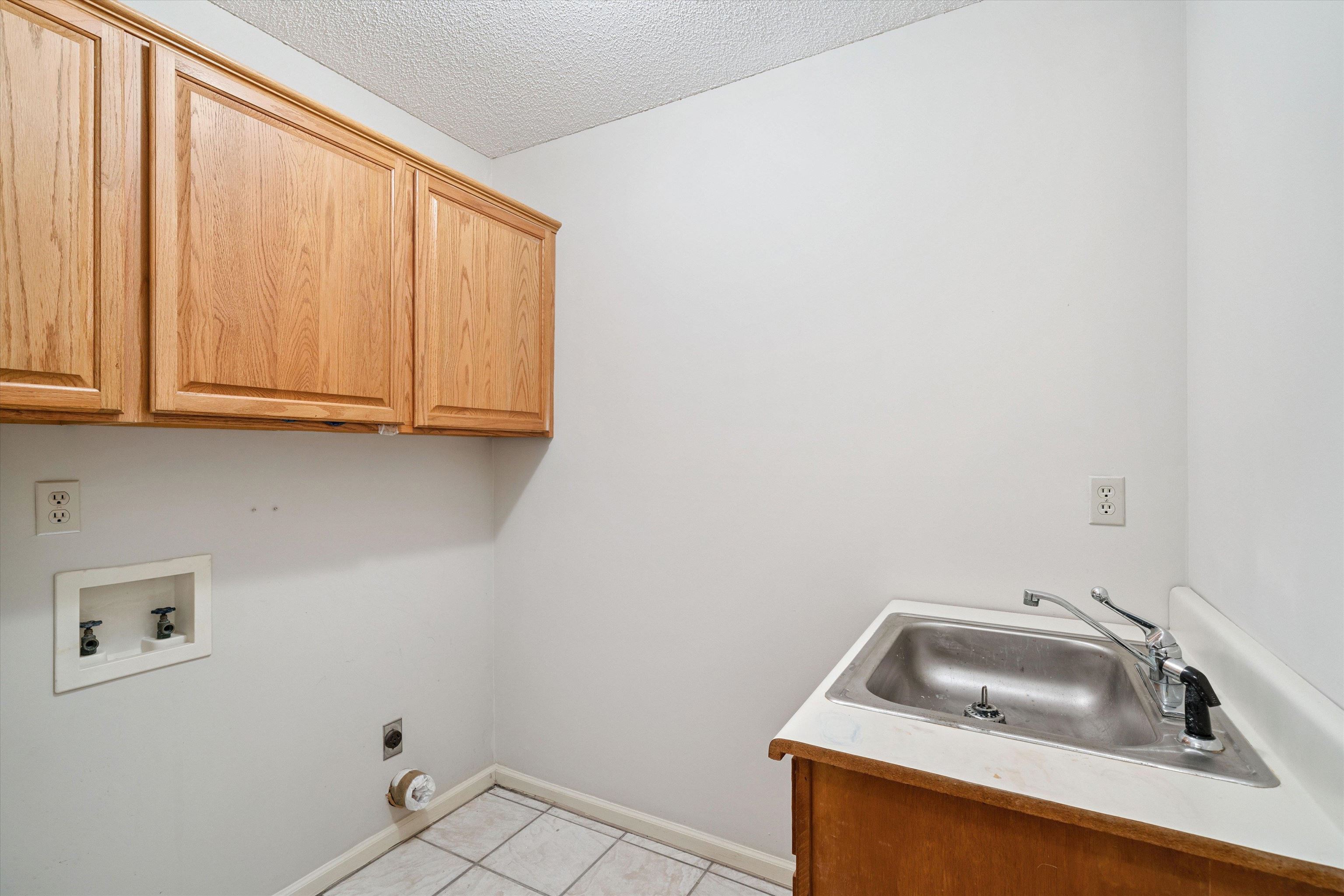 3365 Tomlin Road Somerville, TN 38068 - Photo 15 of 29 a bathroom with a sink and cabinets