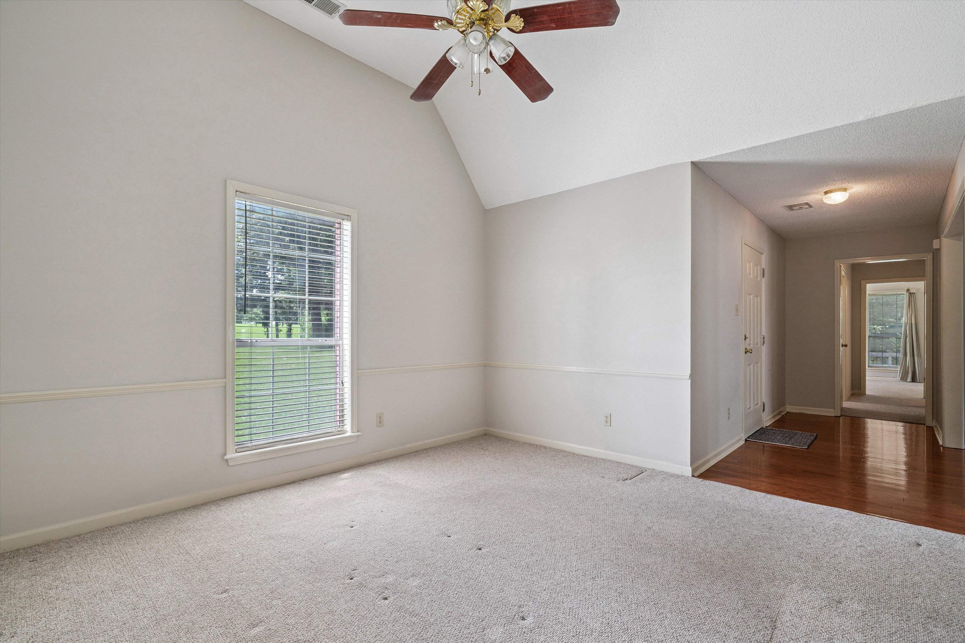 3365 Tomlin Road Somerville, TN 38068 - Photo 5 of 29 an empty room with windows and fan