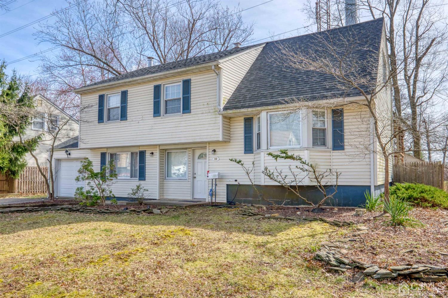 19 Hill Road Edison, NJ 08817 - Photo 1 of 19 a front view of house with yard