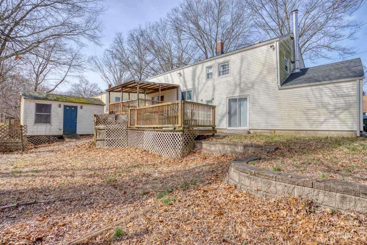 19 Hill Road Edison, NJ 08817 - Photo 18 of 19 a view of a house with a yard