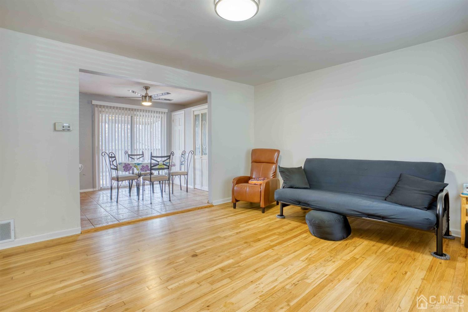 19 Hill Road Edison, NJ 08817 - Photo 4 of 19 a living room with furniture and a wooden floor