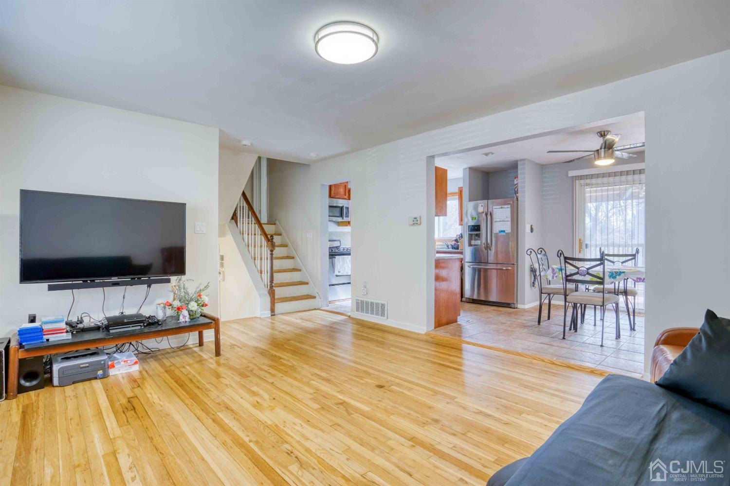19 Hill Road Edison, NJ 08817 - Photo 5 of 19 a view of a livingroom with furniture and a flat screen tv