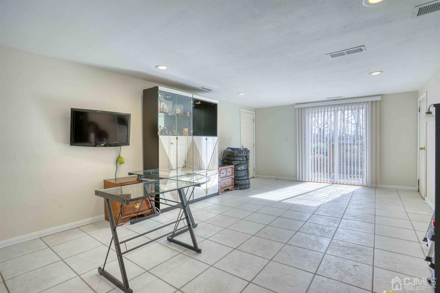 19 Hill Road Edison, NJ 08817 - Photo 10 of 19 a living room with furniture and a flat screen tv
