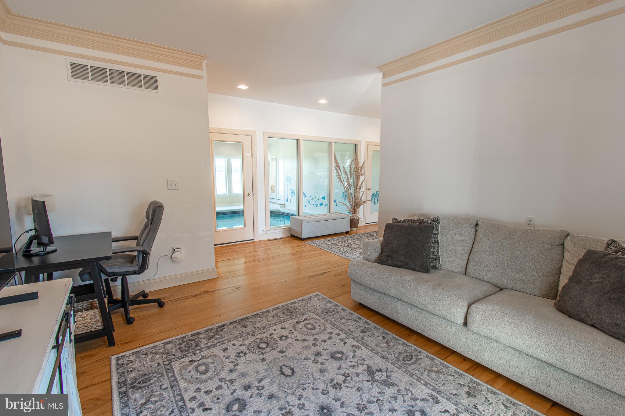 5227 Brooks Road Woolford, MD 21677 - Photo 15 of 68 a living room with furniture and a wooden floor