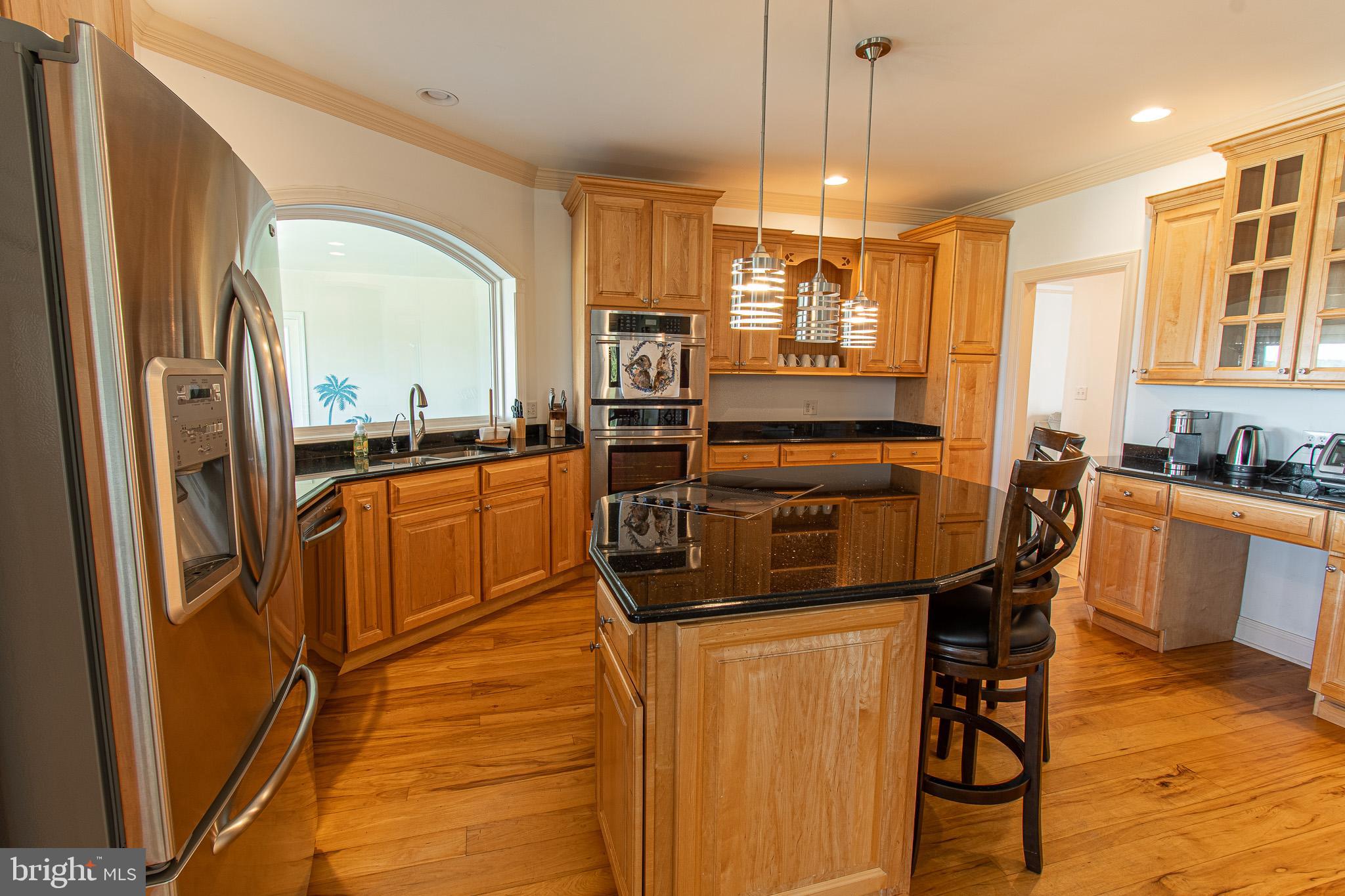 5227 Brooks Road Woolford, MD 21677 - Photo 19 of 68 a kitchen with a refrigerator a stove top oven a sink and dishwasher