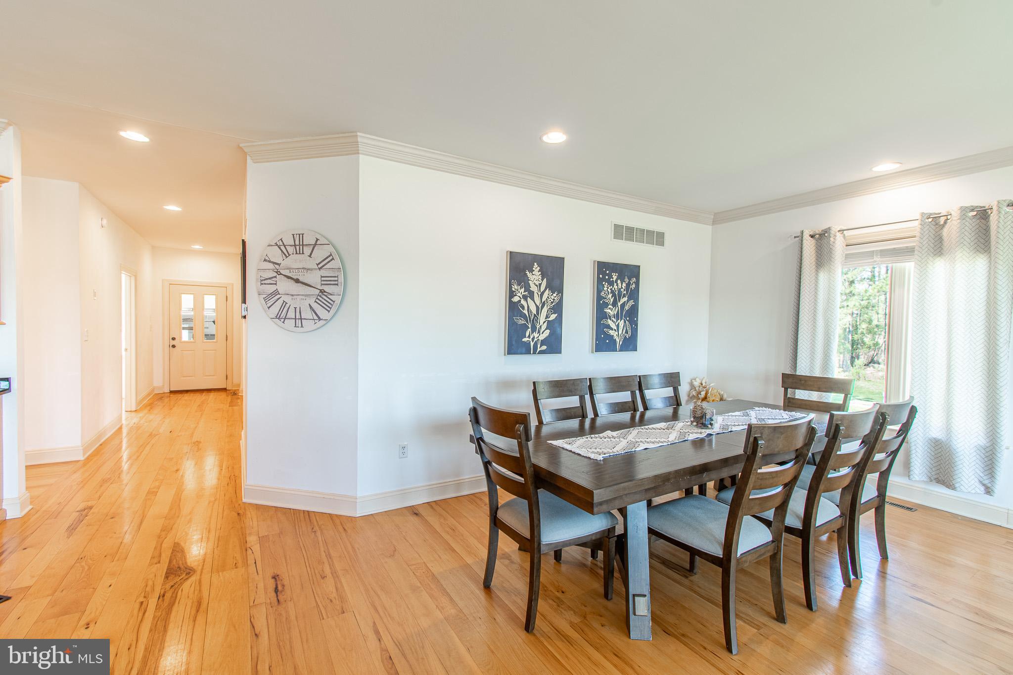 5227 Brooks Road Woolford, MD 21677 - Photo 21 of 68 a dining room with furniture and wooden floor