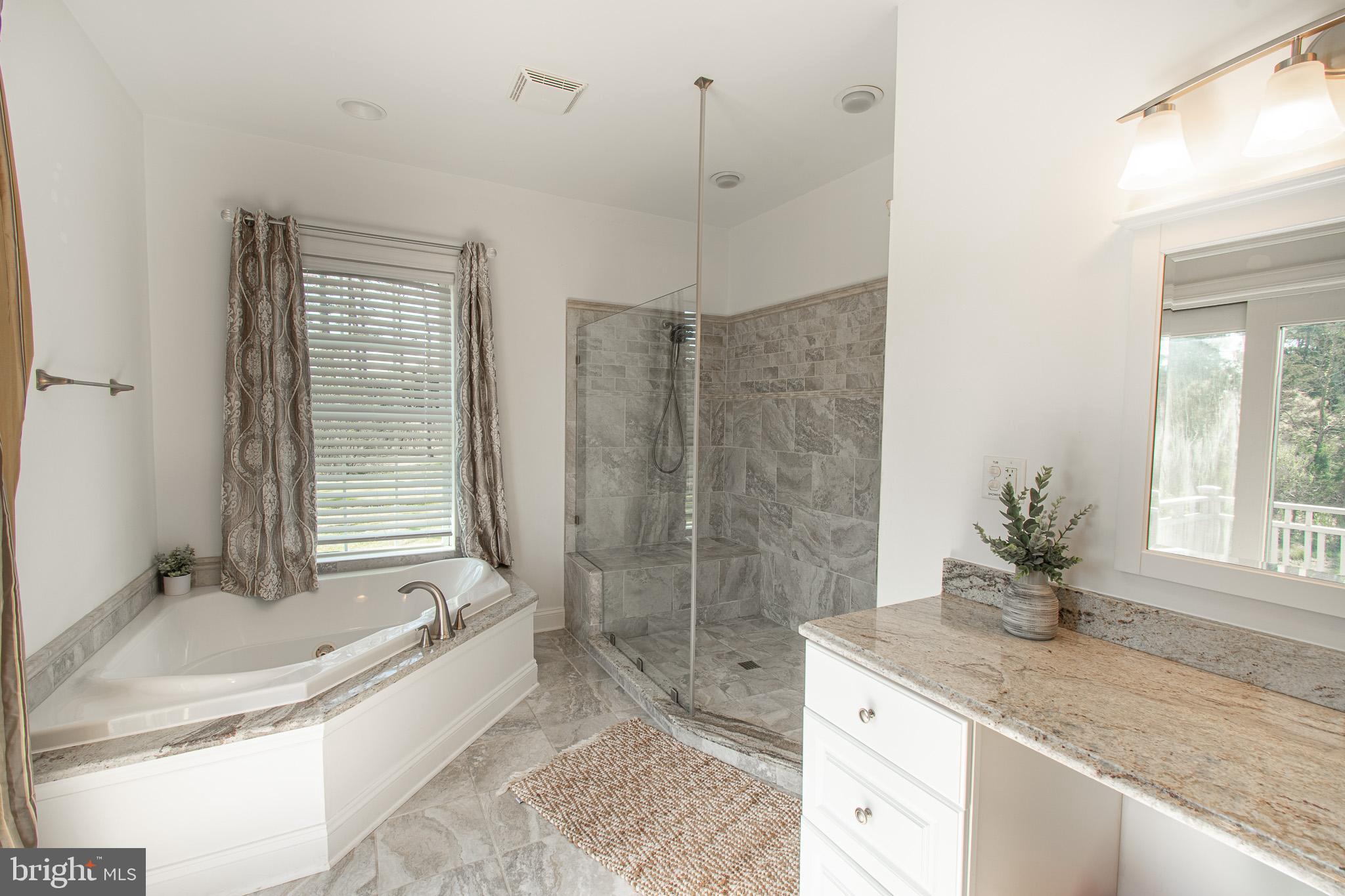 5227 Brooks Road Woolford, MD 21677 - Photo 35 of 68 a bath room with a granite countertop sink and a mirror