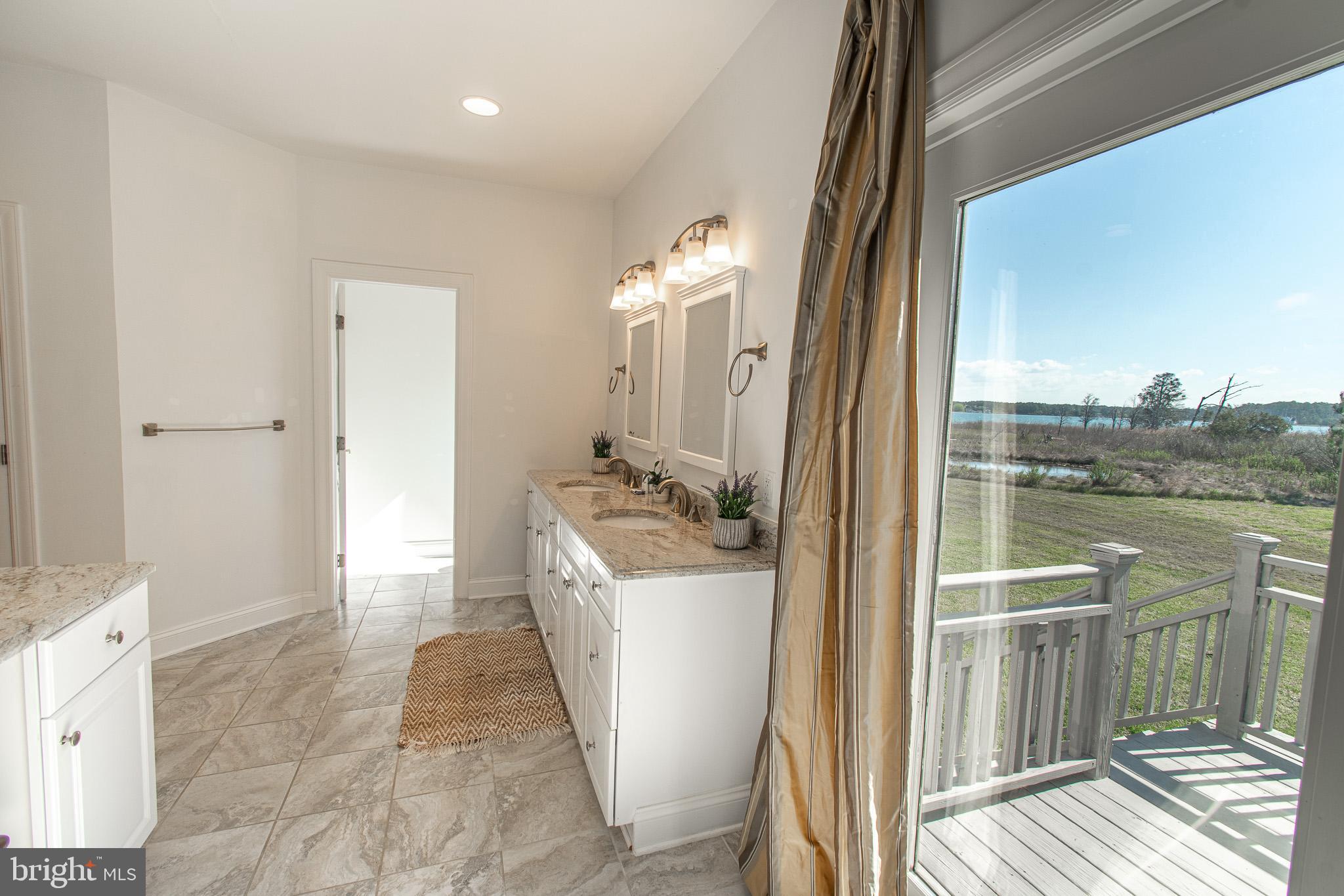 5227 Brooks Road Woolford, MD 21677 - Photo 36 of 68 a bathroom with a sink a mirror and a shower
