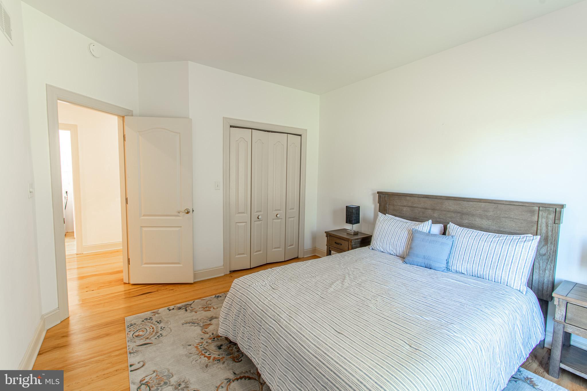 5227 Brooks Road Woolford, MD 21677 - Photo 38 of 68 a bedroom with a bed and wooden floor