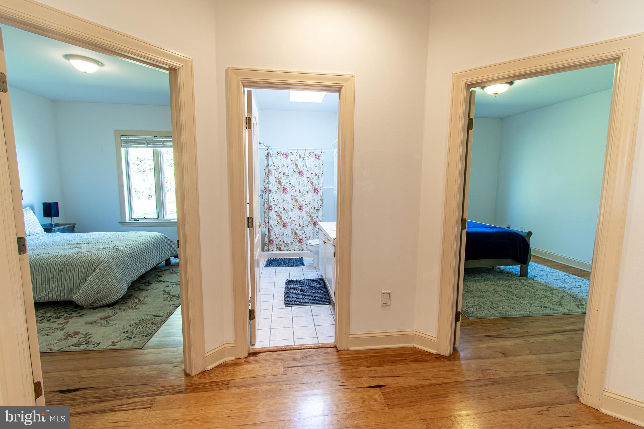5227 Brooks Road Woolford, MD 21677 - Photo 42 of 68 a bedroom with a bed and a wooden floor