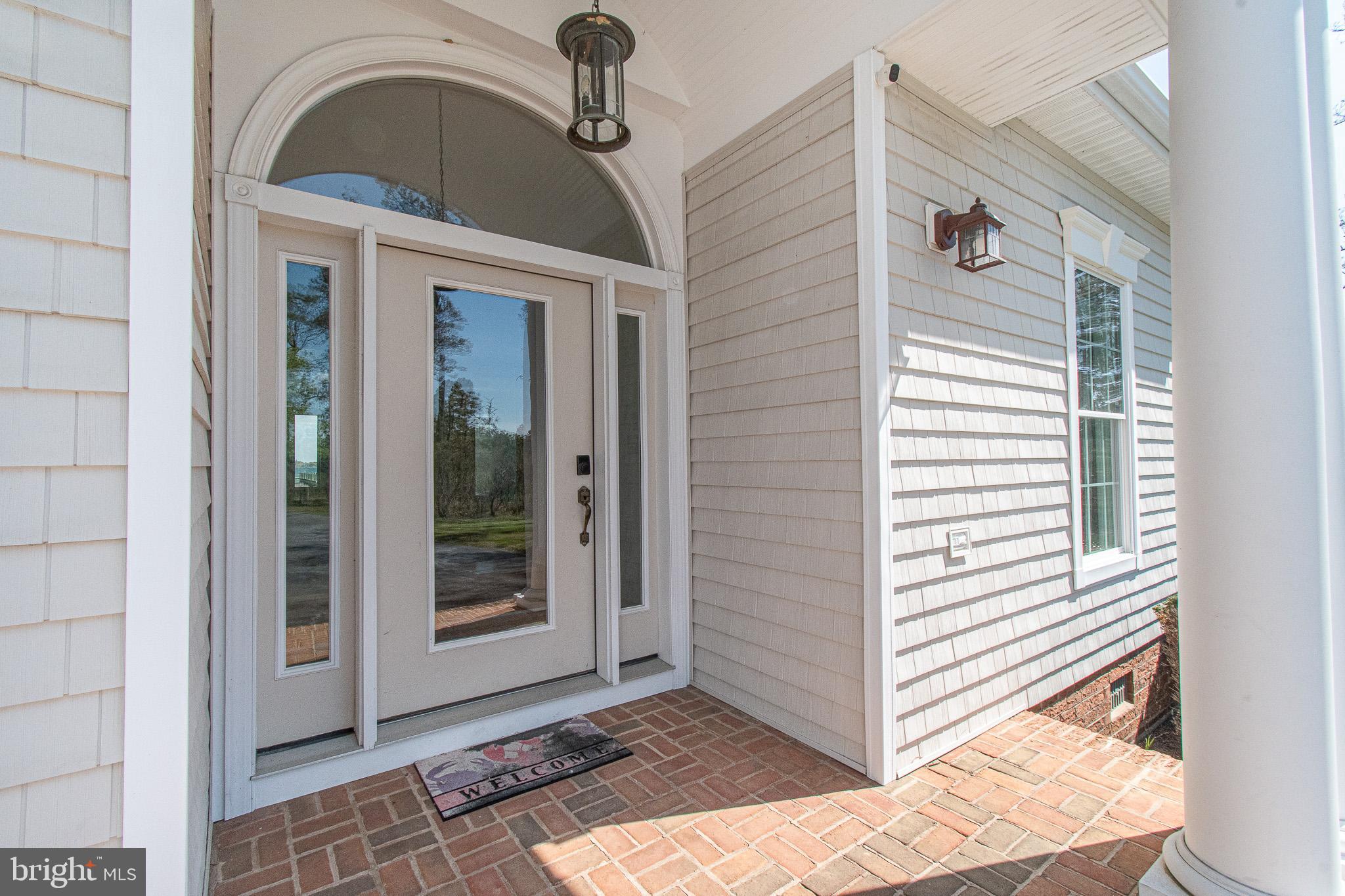 5227 Brooks Road Woolford, MD 21677 - Photo 51 of 68 a view of a entryway door of the house