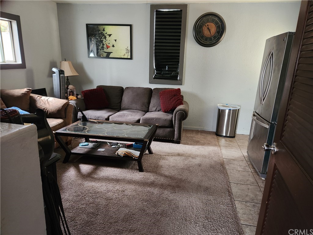 4466 11th Street Riverside, CA 92501 - Photo 17 of 17 a living room with furniture and a window