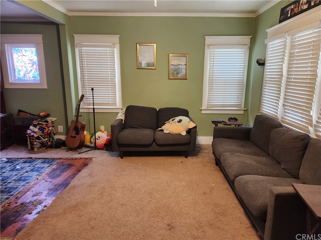 4466 11th Street Riverside, CA 92501 - Photo 3 of 17 a living room with furniture window and couch