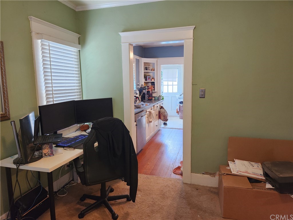 4466 11th Street Riverside, CA 92501 - Photo 7 of 17 a workspace with furniture and a window