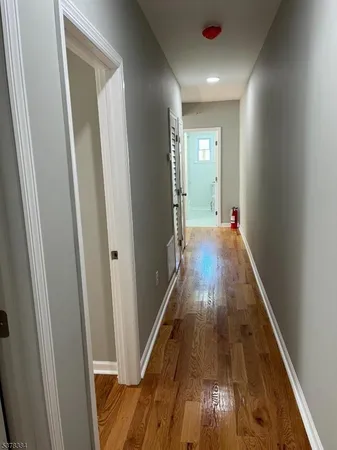 a view of entryway with wooden floor