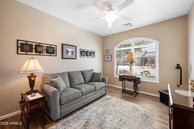 a living room with furniture and a window
