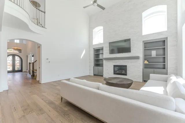 a kitchen with a dining table chairs cabinets and stainless steel appliances