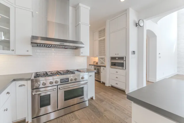 a spacious bedroom with a bed and a window