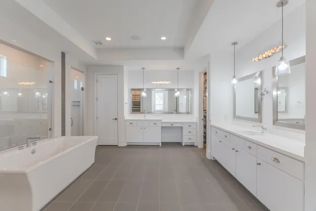 a bathroom with a sink shower and a toilet