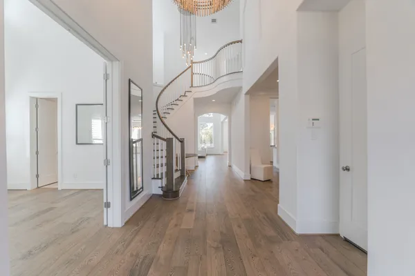a living room with a sink furniture and a wooden floor