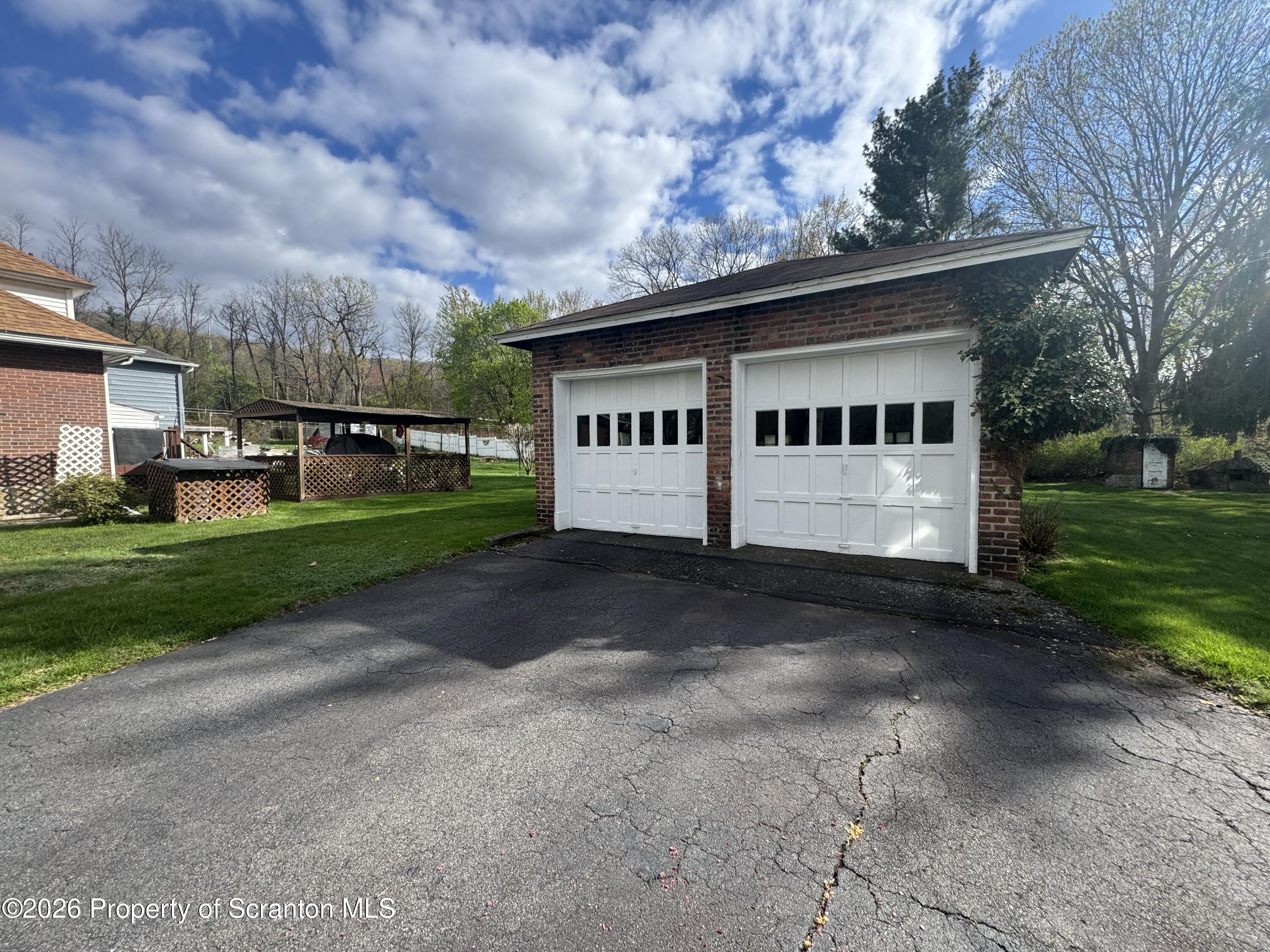 2120 Myrtle Street Scranton, PA 18510 - Photo 9 of 42 a front view of a house with a yard