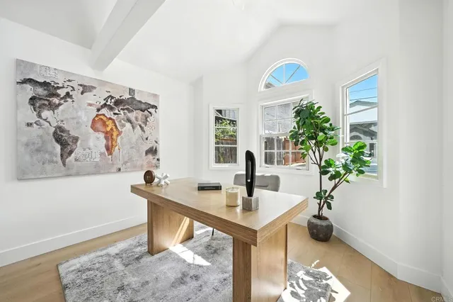 a view of a dining room with furniture and window