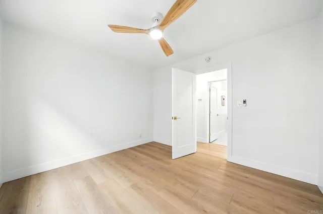 a bedroom with a large bed and a couch