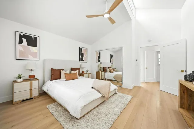 a front view of a house with a garden and yard