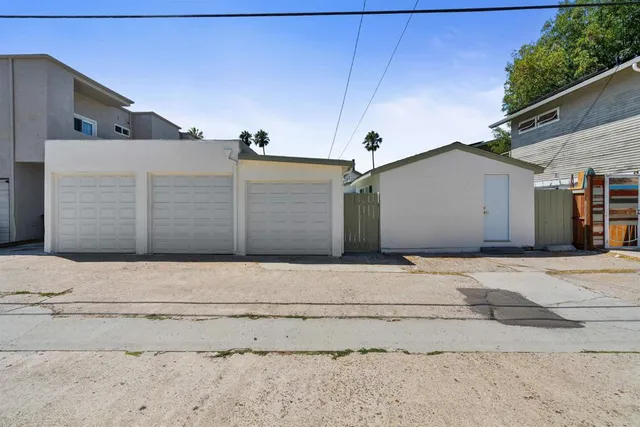 a view of a white building with many windows