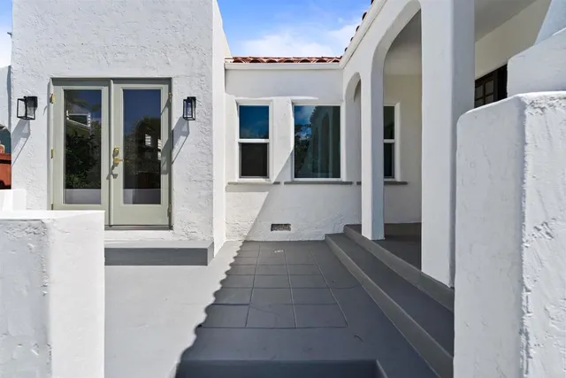 a view of a entryway door of the house and living room