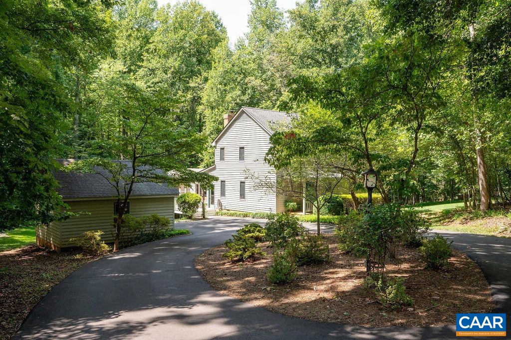 2110 Whippoorwill Road Charlottesville, VA 22901 - Photo 1 of 37 a front view of a house with a yard and tree s