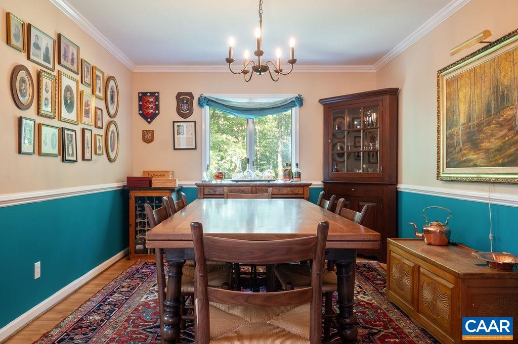 2110 Whippoorwill Road Charlottesville, VA 22901 - Photo 12 of 37 a view of a dining room with furniture window and outside view