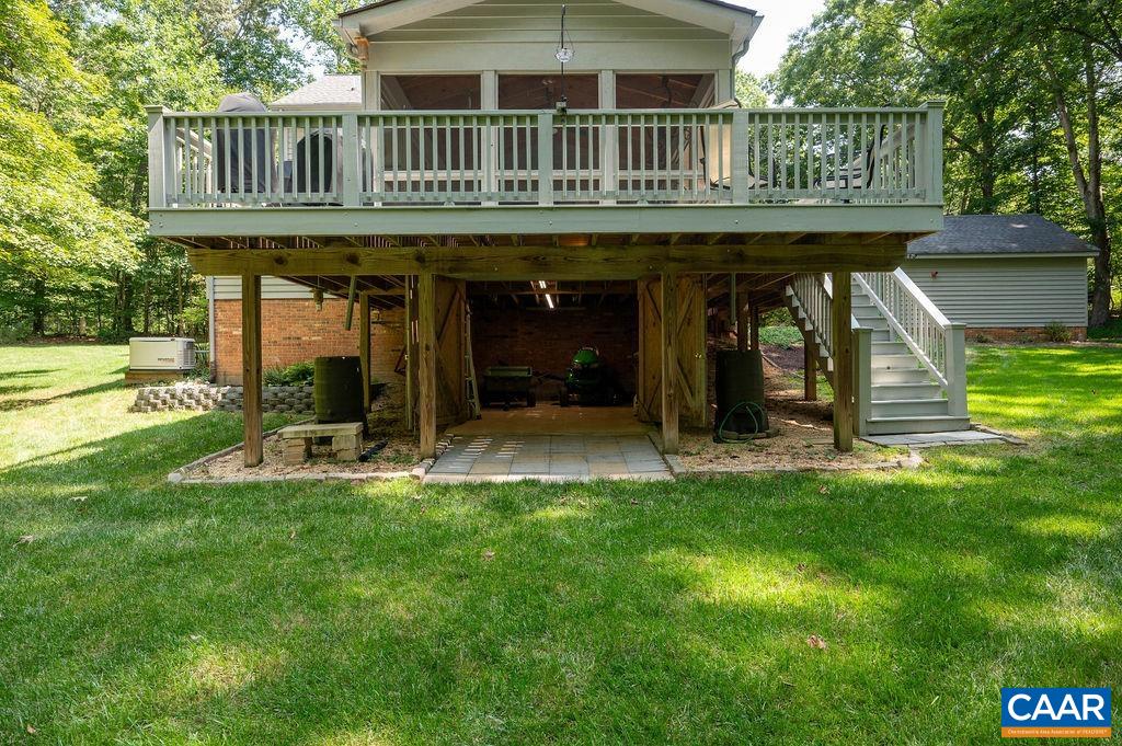 2110 Whippoorwill Road Charlottesville, VA 22901 - Photo 25 of 37 a view of a chair and tables in the backyard