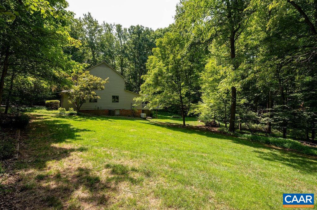 2110 Whippoorwill Road Charlottesville, VA 22901 - Photo 29 of 37 a view of a yard with a tree