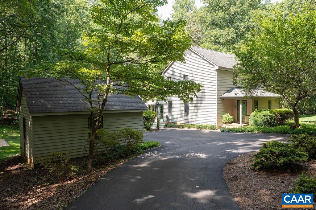 2110 Whippoorwill Road Charlottesville, VA 22901 - Photo 30 of 37 a view of a house with a tree and a yard