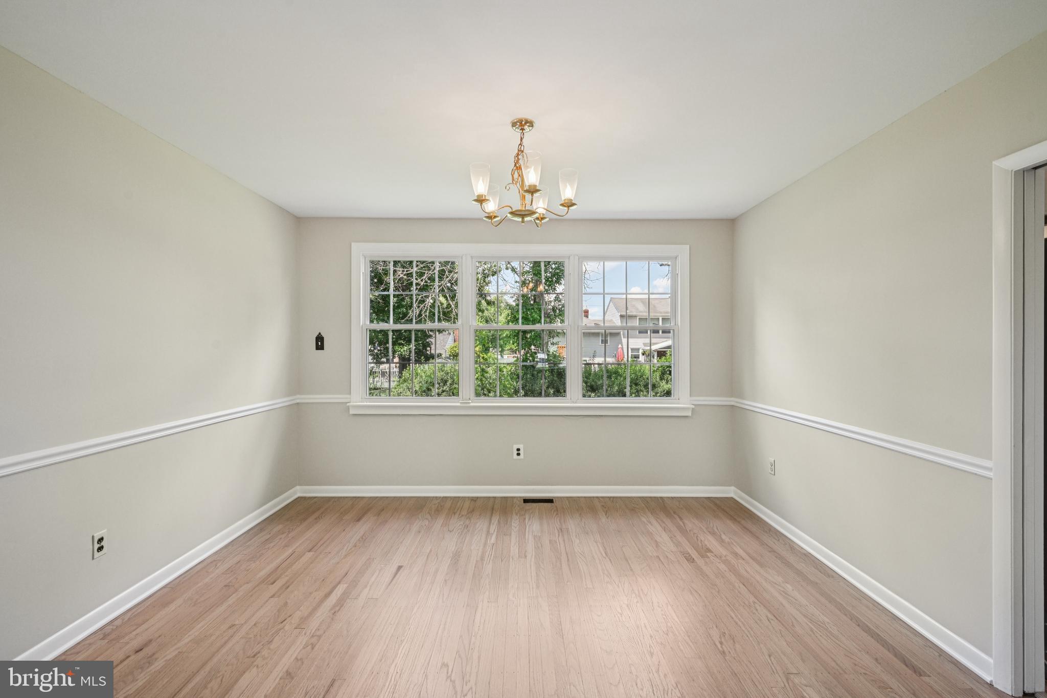 143 Ashbrook Road Cherry Hill, NJ 08034 - Photo 11 of 40 an empty room with wooden floor and windows