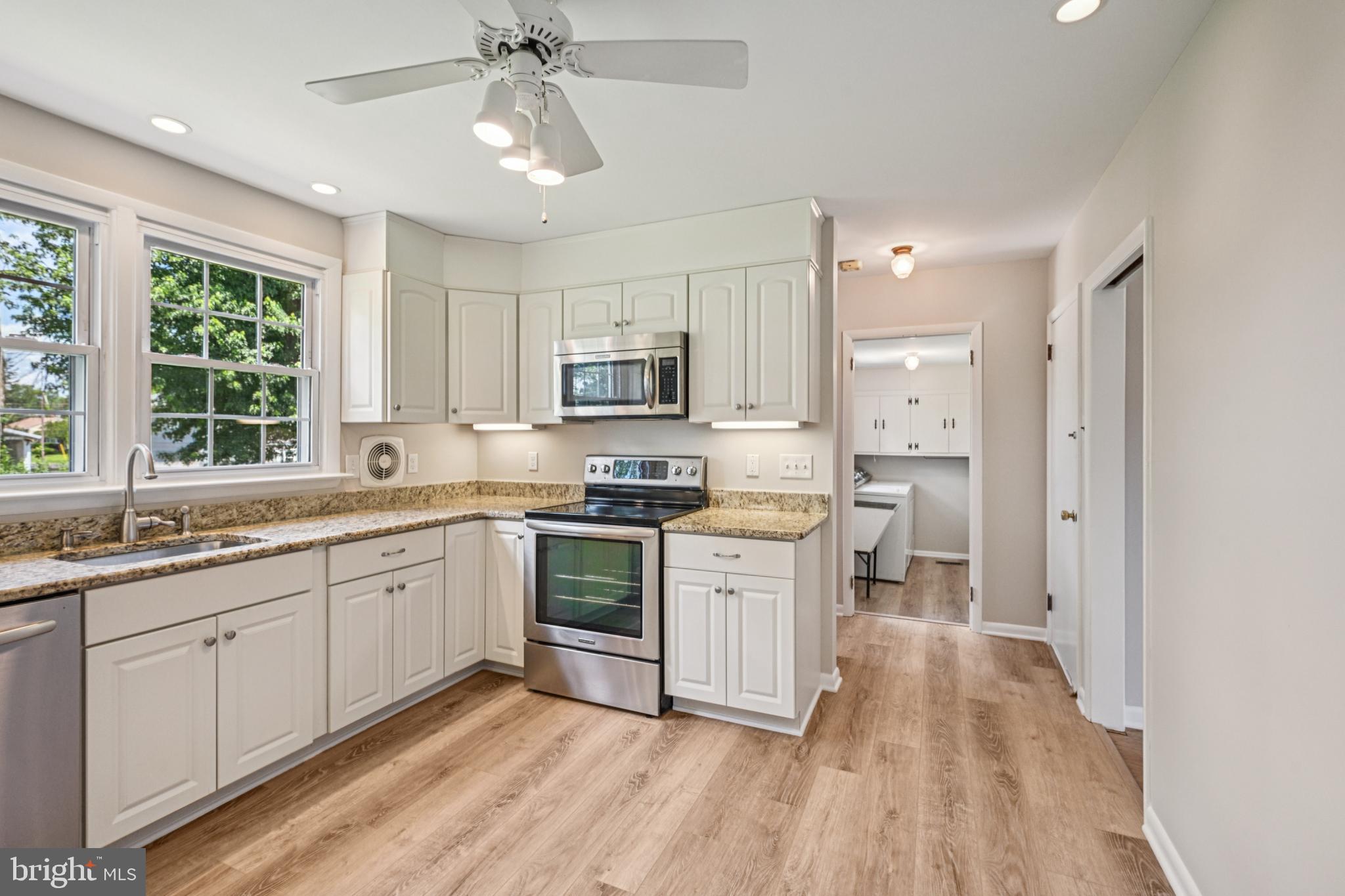 143 Ashbrook Road Cherry Hill, NJ 08034 - Photo 14 of 40 a kitchen with sink a microwave and cabinets