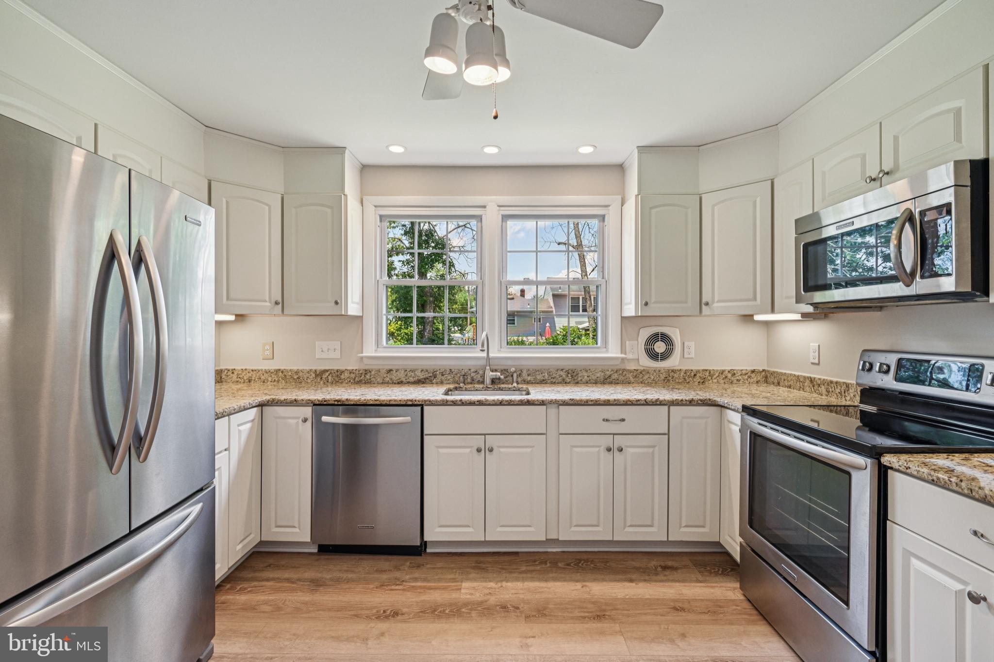 143 Ashbrook Road Cherry Hill, NJ 08034 - Photo 15 of 40 a kitchen with stainless steel appliances granite countertop a refrigerator and a sink