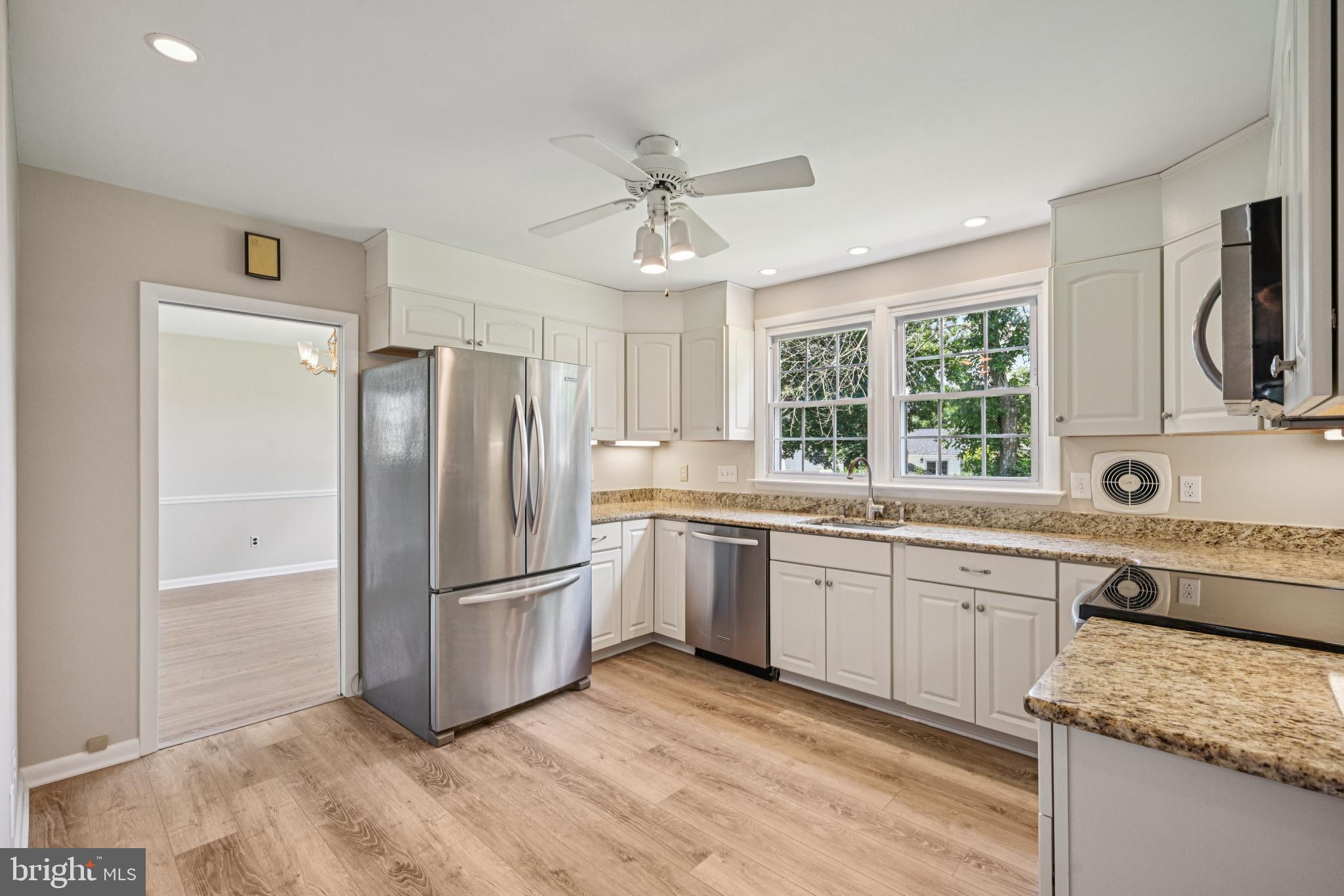 143 Ashbrook Road Cherry Hill, NJ 08034 - Photo 16 of 40 a kitchen with granite countertop a sink appliances a window and stainless steel appliances