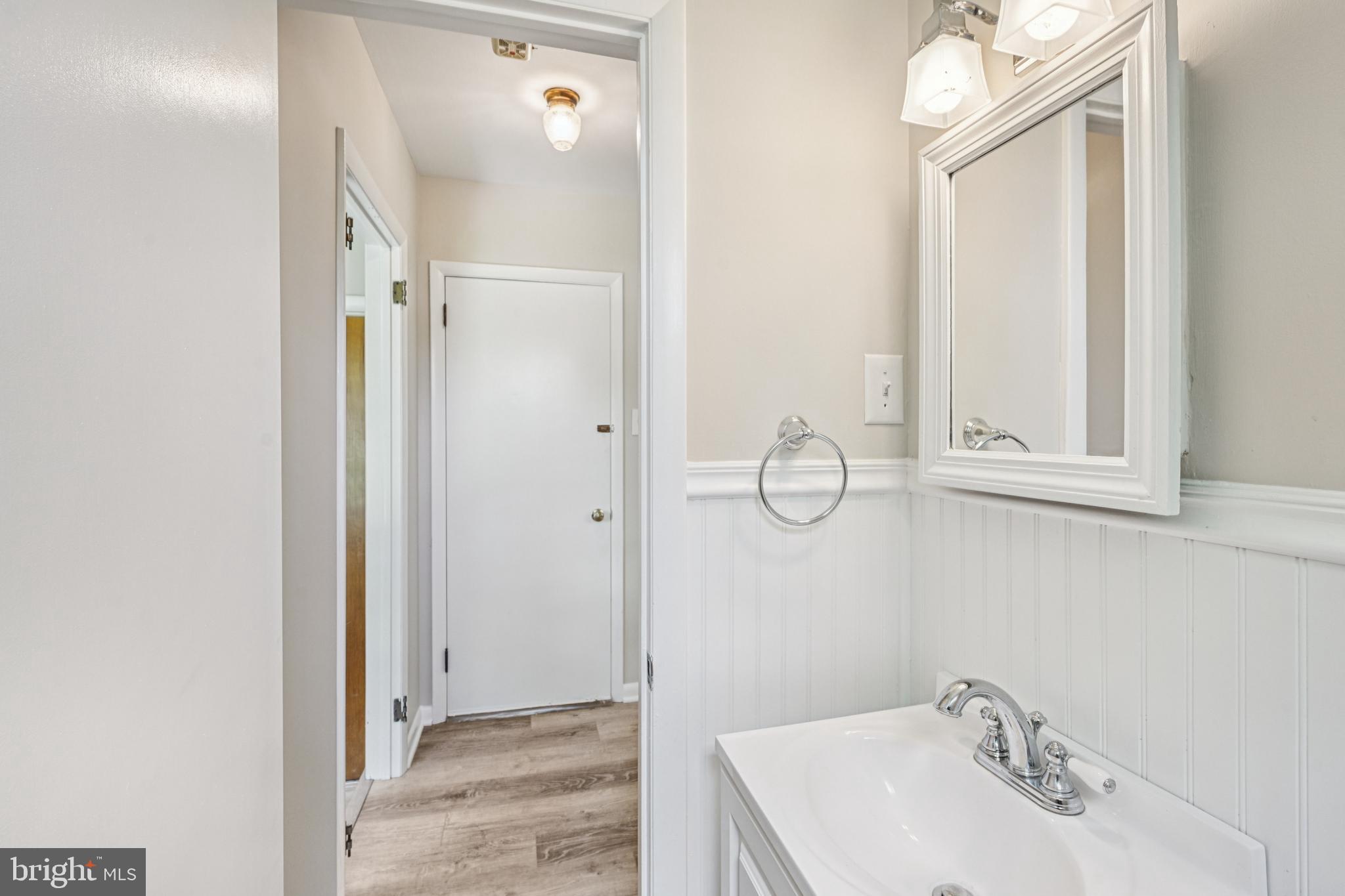 143 Ashbrook Road Cherry Hill, NJ 08034 - Photo 19 of 40 a bathroom with a sink a mirror and shower
