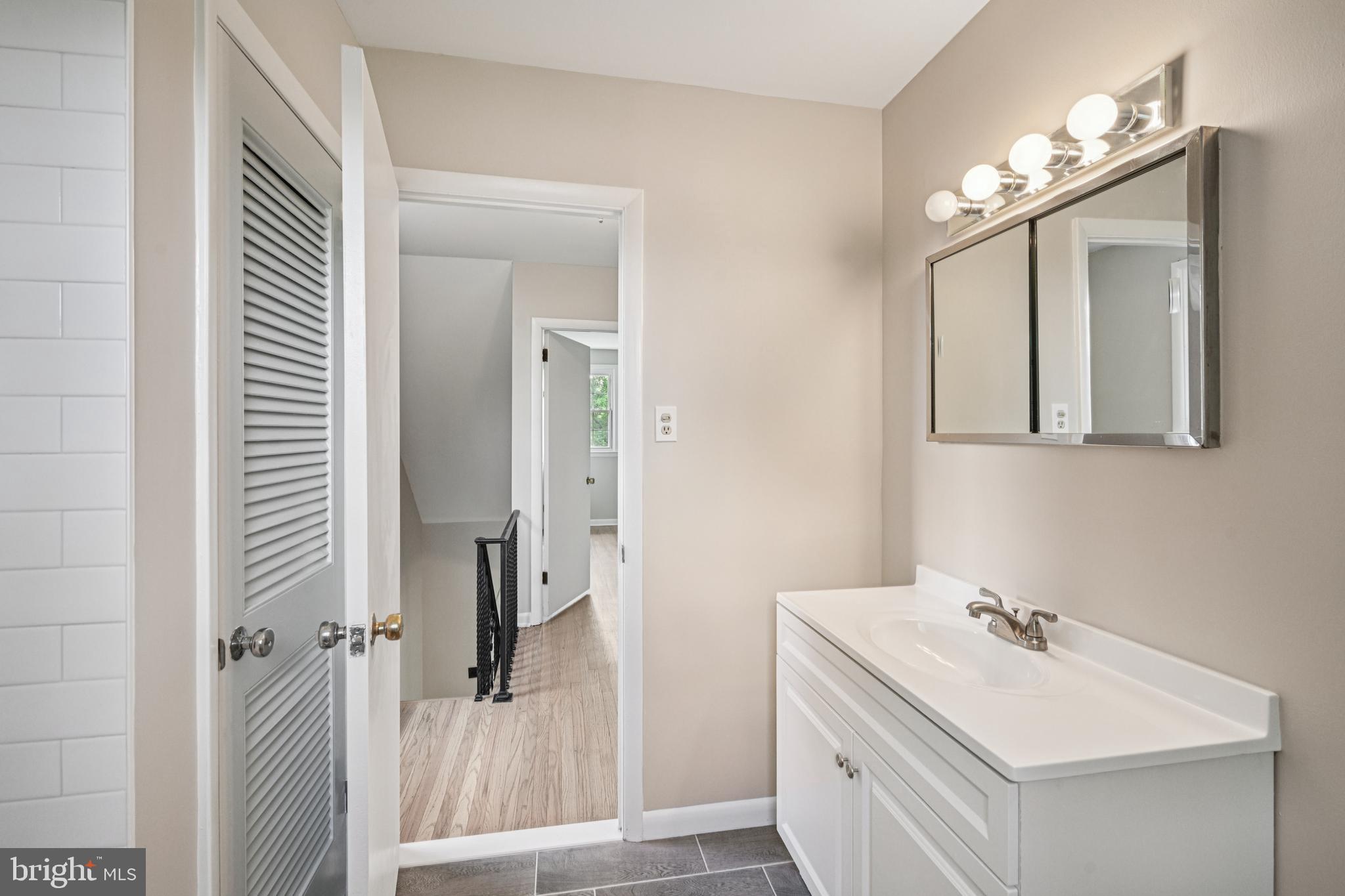 143 Ashbrook Road Cherry Hill, NJ 08034 - Photo 21 of 40 a bathroom with a sink vanity and a mirror
